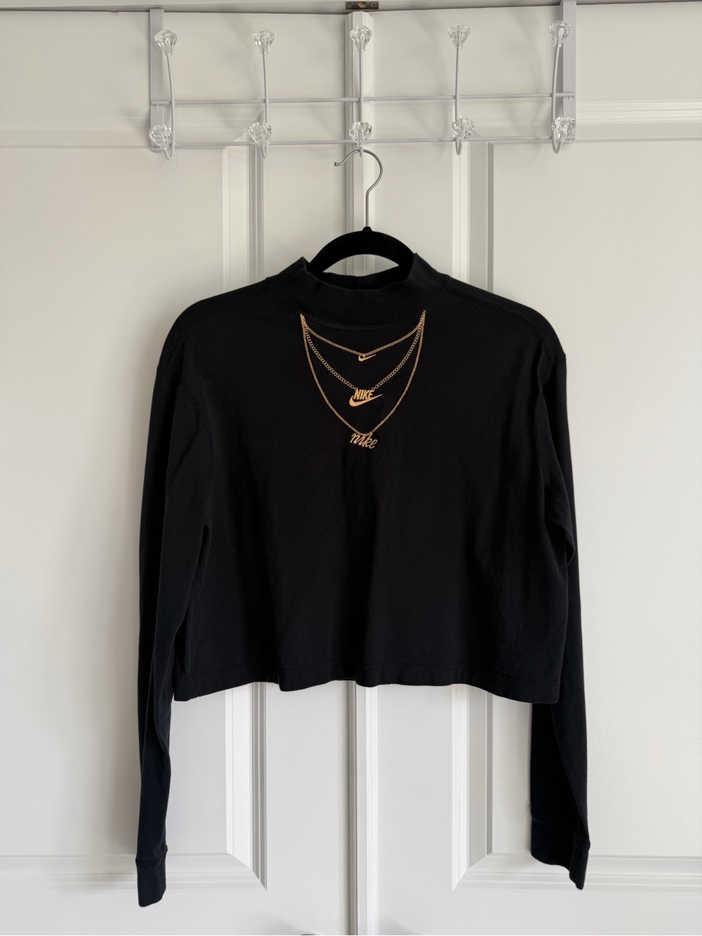 Nike Black Cropped Long-Sleeve Mock Neck Top with Gold Necklace Graphic